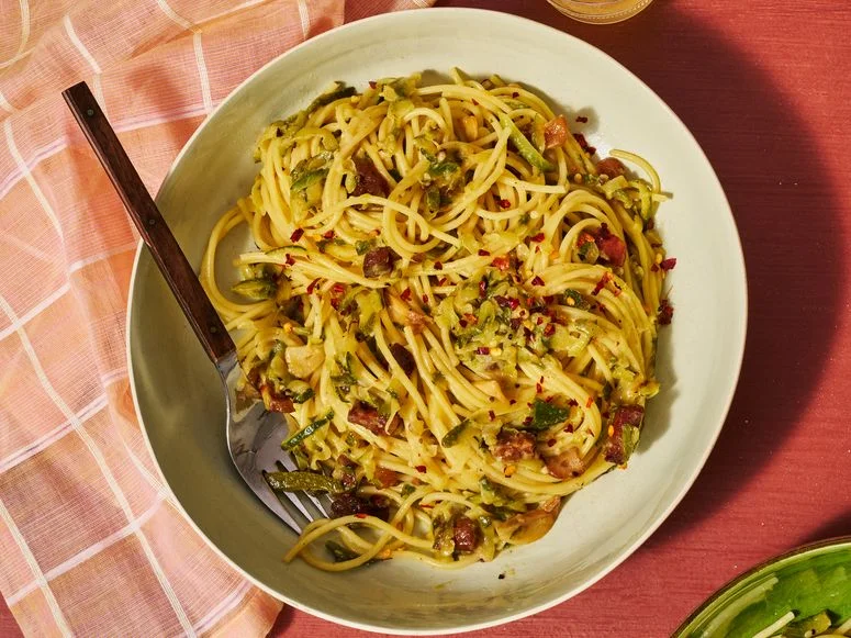 Zucchini Amatriciana beautifully twirled in a stone bowl