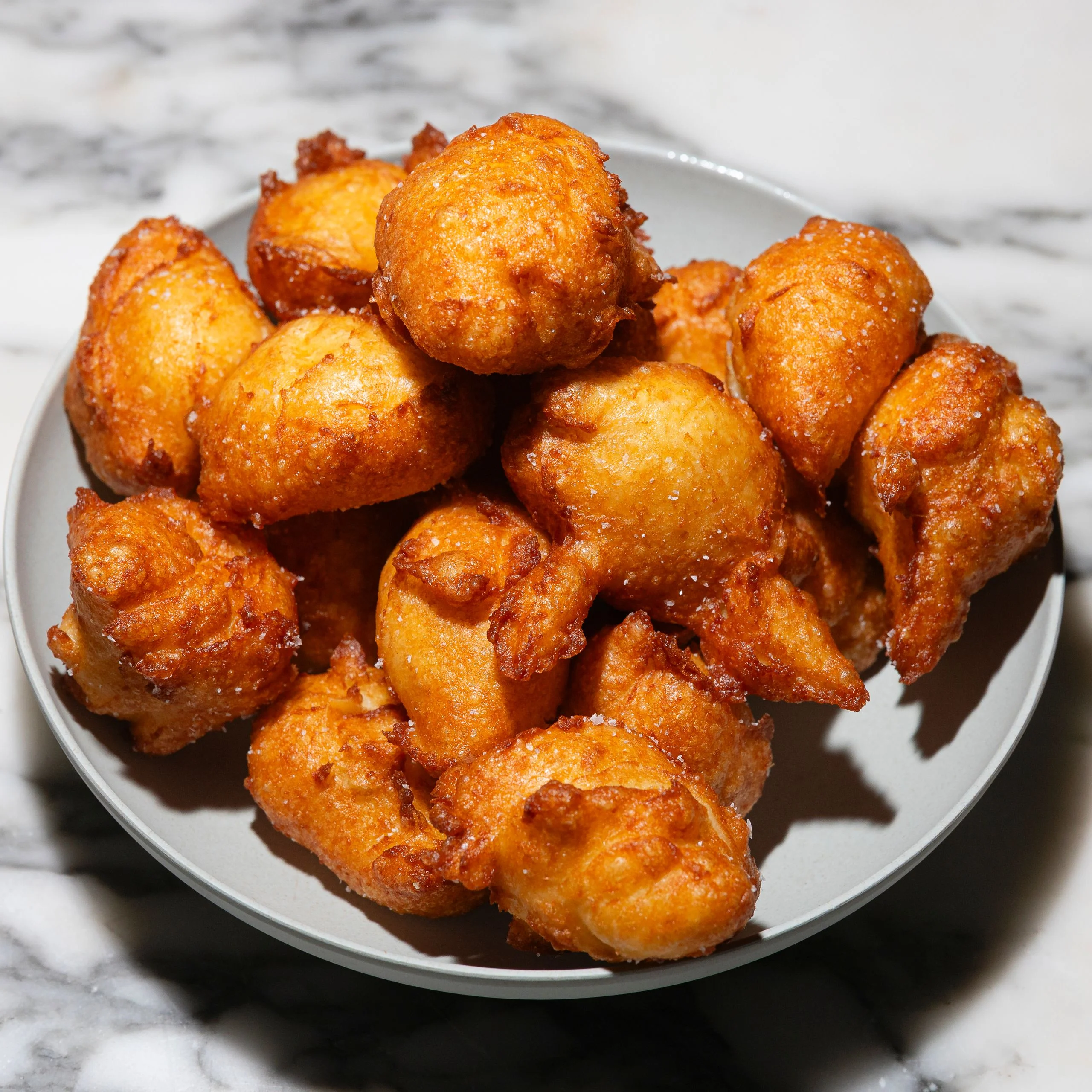 Mashed potatoes and choux pastry formed into balls and fried.